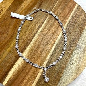 A beautiful Necklace with cubic zirconia. 17 inches long. Brand New.